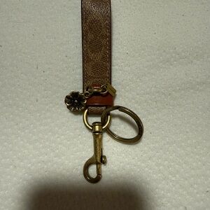 Coach Brown Leather Logo Strap Keyring with Brass Floral Charm